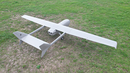 Skyeye 5000mm carbon fiber fixed wing UAV drone on grassy field.