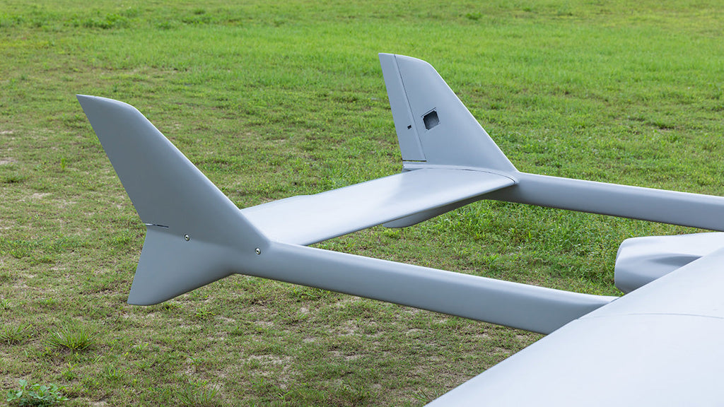 Skyeye 5000mm carbon fiber fixed wing UAV drone on grassy field.
