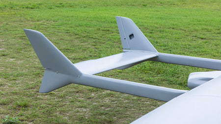Skyeye 5000mm carbon fiber fixed wing UAV drone on grassy field.