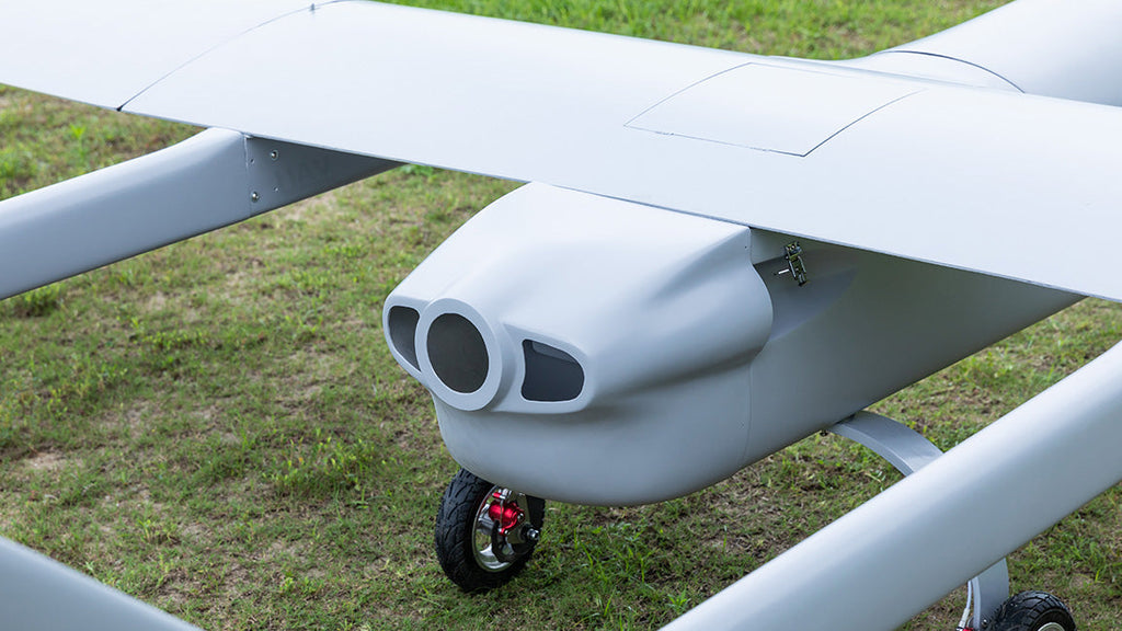 Skyeye 5000mm carbon fiber fixed wing UAV on grassy field.