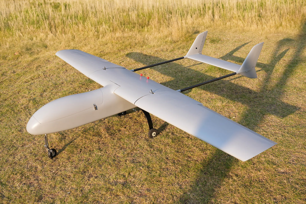 Skyeye SR260 2600mm UAV fixed wing drone on grass field, showcasing its modular design and aerodynamic efficiency.
