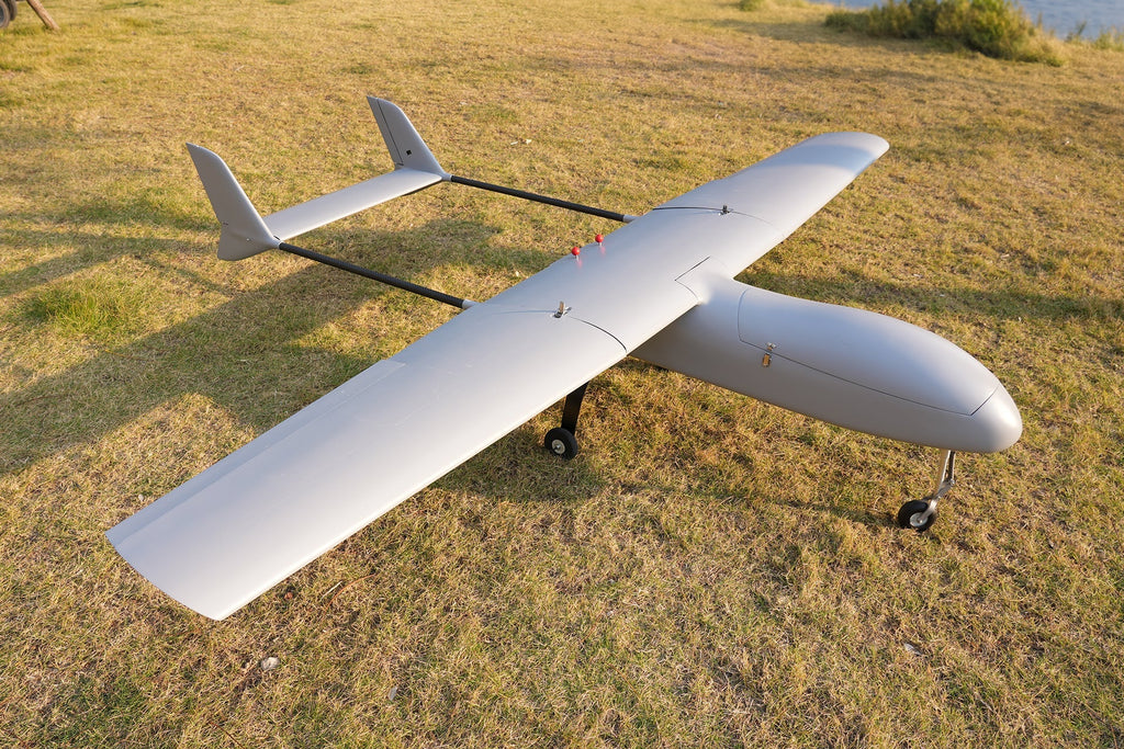 Skyeye SR260 2600mm fixed wing UAV drone on grass, showcasing wingspan and aerodynamic design for aerial survey and mapping.
