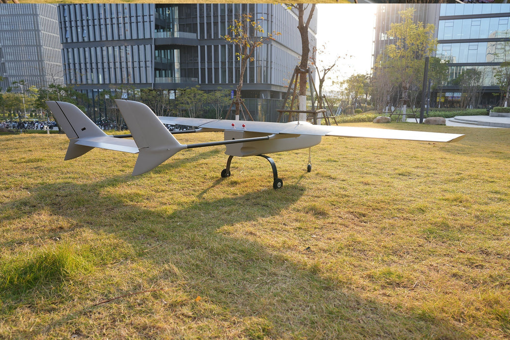 Skyeye SR260 2600mm UAV fixed wing drone on grass near modern buildings.