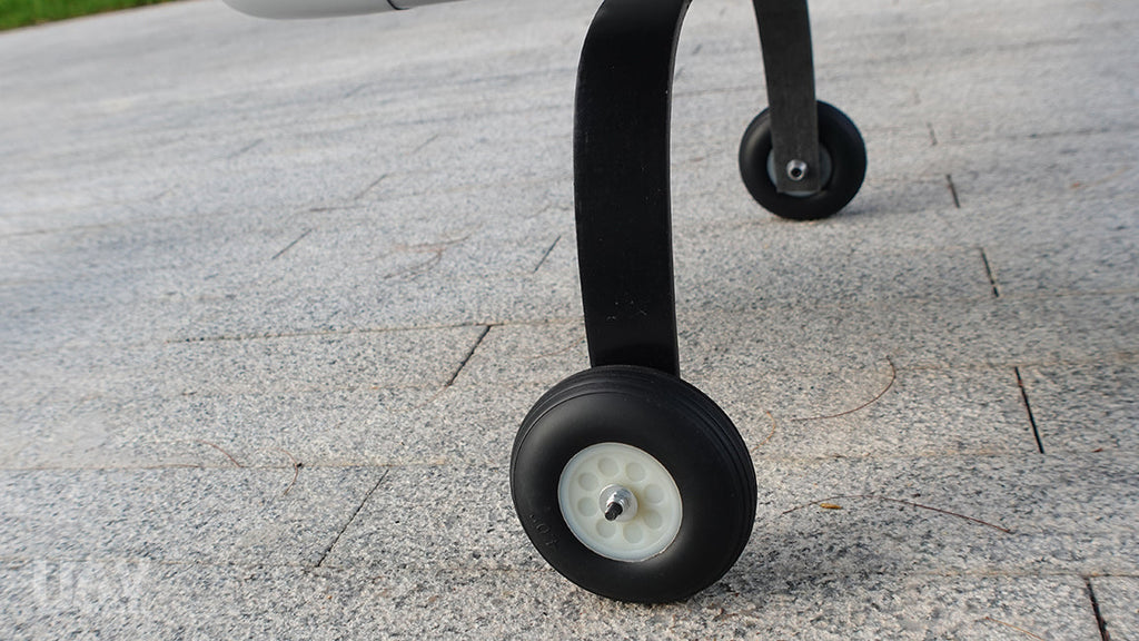Skyeye Glass fiber 3220mm UAV Fixed Wing Drone landing gear close-up on stone surface.