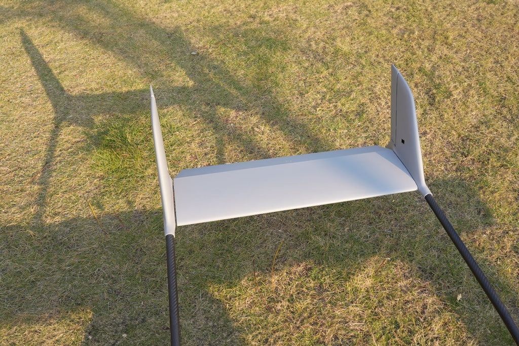Skyeye SR260 UAV wings on grass, showcasing fixed-wing drone design for aerial surveys.