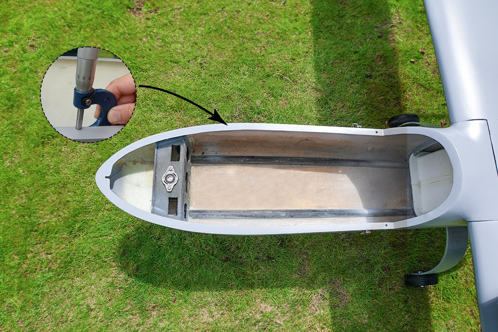 Skyeye Carbon Fiber 3600mm UAV Fixed Wing Drone, open fuselage, green grass background.