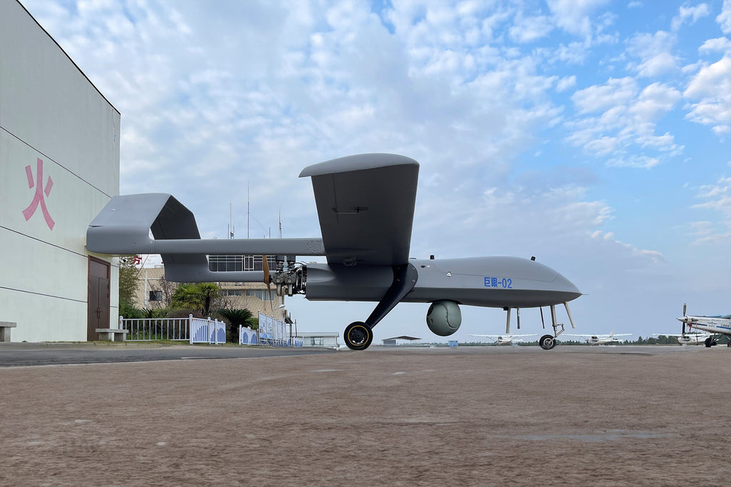 Skyeye Giant Eye 6050mm Fixed Wing Drone SG605 on airfield with blue sky background, showcasing its large size and robust design.