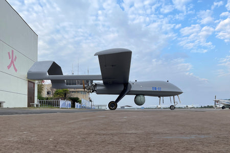 Skyeye Giant Eye 6050mm Fixed Wing Drone SG605 on airfield with blue sky background, showcasing its large size and robust design.