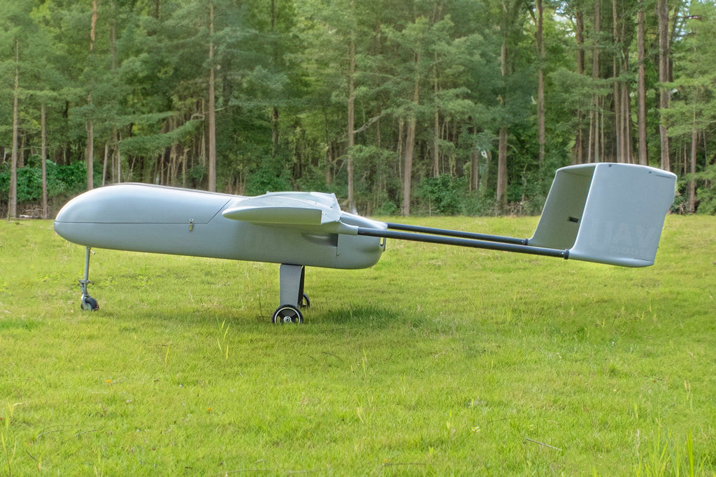 Skyeye 4500mm UAV Fixed Wing Drone on grassy field, showcasing aerodynamic design and large wingspan.